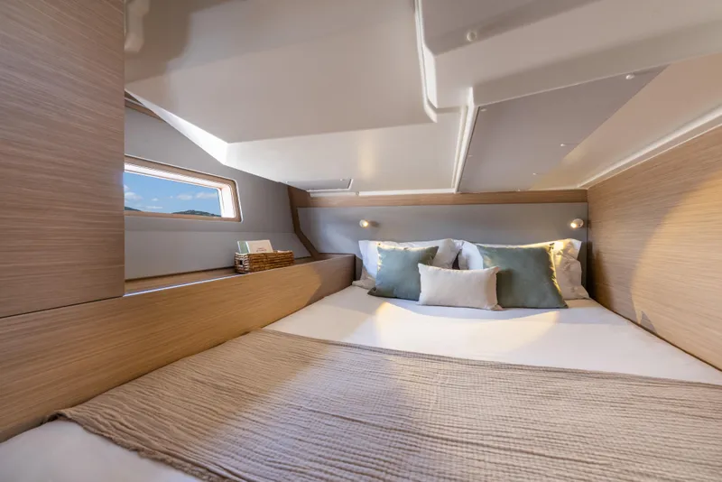 Slide: The Image of Luxurious cabin interior of 2026 Beneteau Oceanis 52 yacht with cozy bedding. - 11