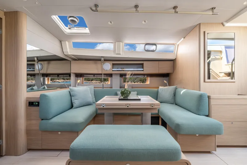 Slide: The Image of Luxurious interior of 2026 Beneteau Oceanis 52 yacht with modern seating and skylight. - 5