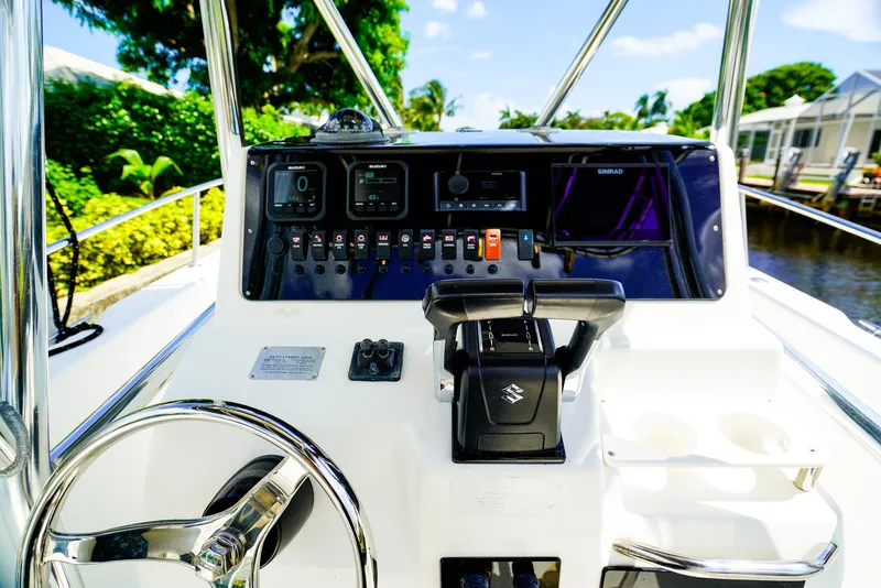 Slide: The Image of Century 2600 CC 1999 boat dashboard with steering wheel and control panel. - 7