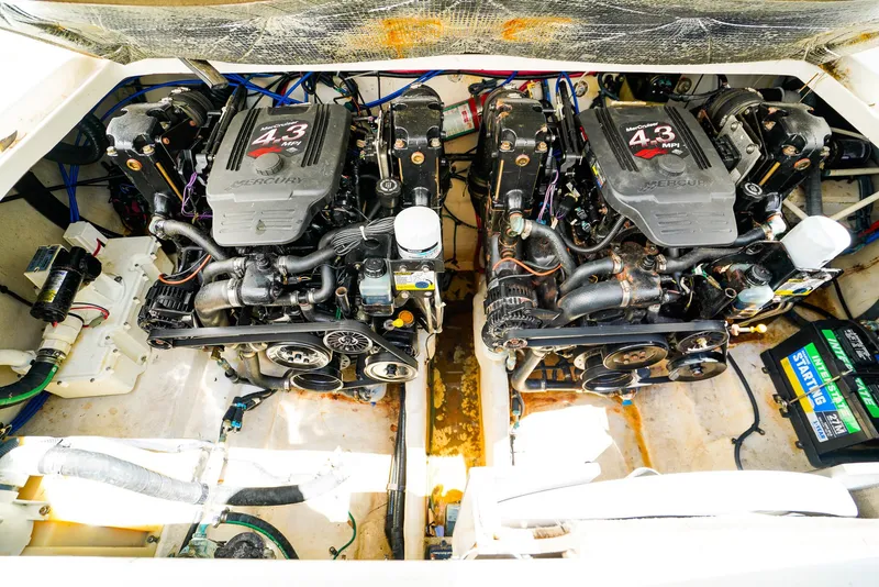 Slide: The Image of Twin engines in a 2007 Sea Ray 280 Sundancer boat engine compartment. - 31
