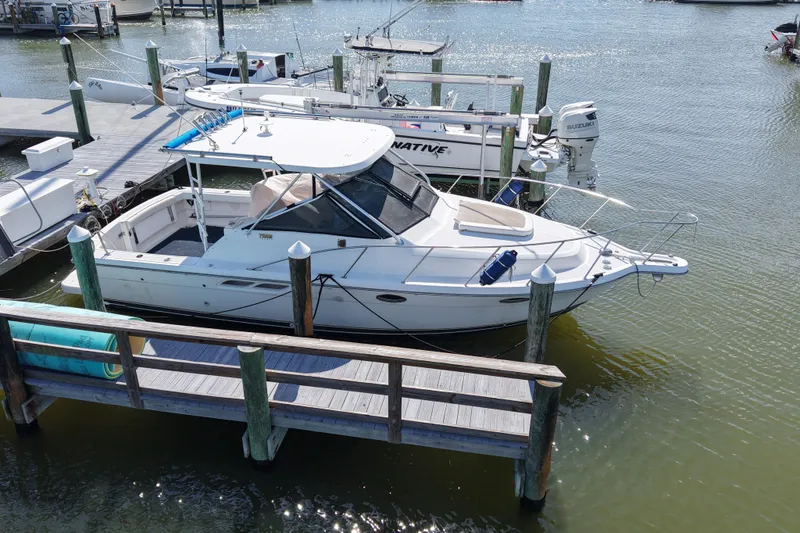 The Image of 2006 Tiara Yachts 2900 Open Classic docked at marina, side view. - 0