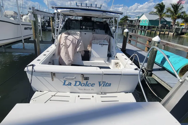 Slide: The Image of 2006 Tiara Yachts 2900 Open Classic docked, rear view with "La Dolce Vita" name. - 19