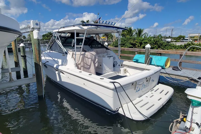 Slide: The Image of 2006 Tiara Yachts 2900 Open Classic docked, featuring sleek design and spacious deck. - 4