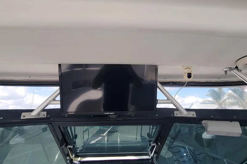 Slide: The Image of Interior view of a 2006 Tiara Yachts 2900 Open Classic with mounted TV screen. - 9