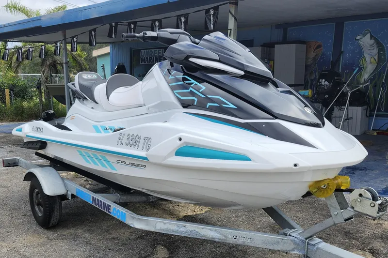 The Image of 2022 Yamaha WaveRunner VX Cruiser on trailer, parked outdoors near marine shop. - 1