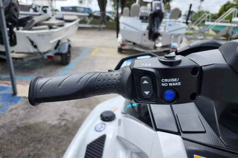 Slide: The Image of Close-up of 2022 Yamaha WaveRunner VX Cruiser handle with cruise control buttons. - 10