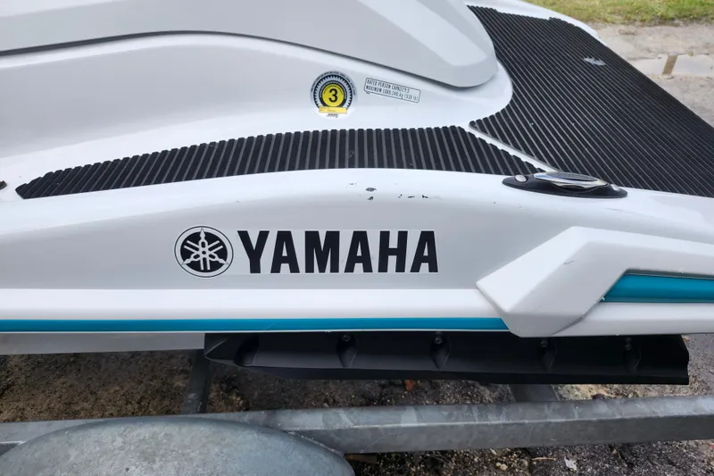 Slide: The Image of 2022 Yamaha WaveRunner VX Cruiser, white with black and blue accents, close-up view. - 13