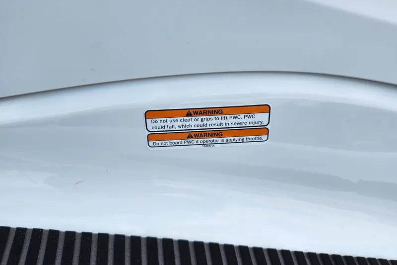 Slide: The Image of Warning label on 2022 Yamaha WaveRunner VX Cruiser, cautioning against improper lifting and boarding. - 15