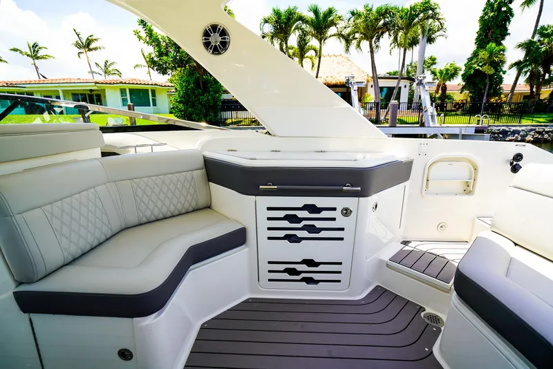 Slide: The Image of Luxurious interior of 2022 Sea Ray SLX 310 OB boat with elegant seating and modern design. - 14