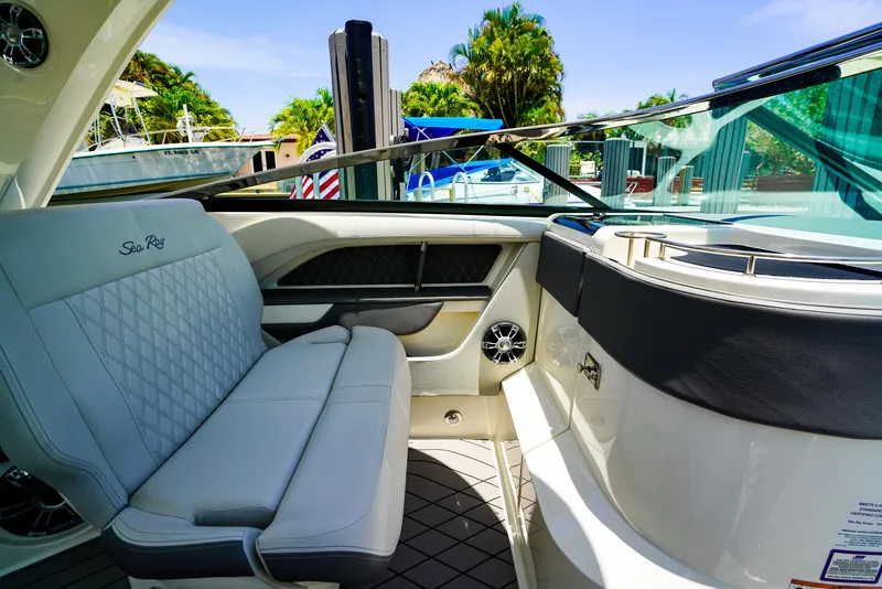 Slide: The Image of 2022 Sea Ray SLX 310 OB interior with luxurious seating and sleek design. - 16