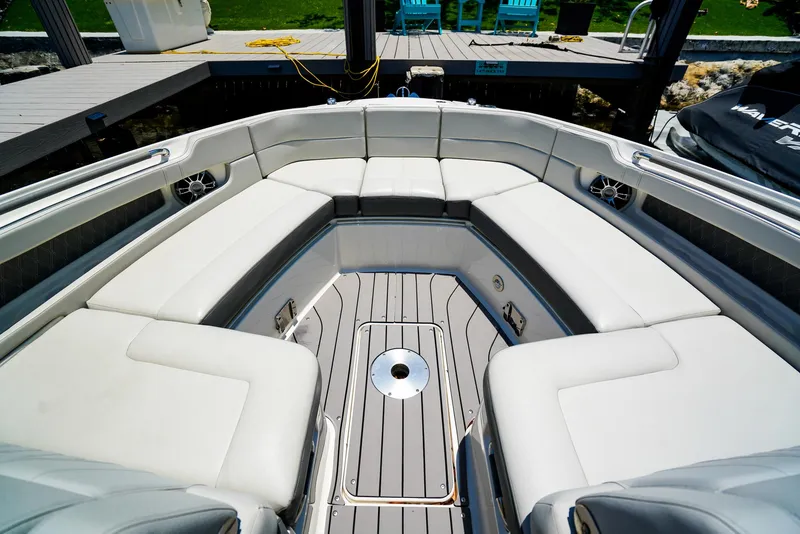 Slide: The Image of 2022 Sea Ray SLX 310 OB boat interior with spacious seating and sleek design. - 22