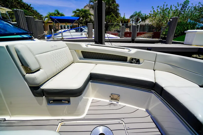 Slide: The Image of 2022 Sea Ray SLX 310 OB boat with luxurious seating and sleek design. - 24