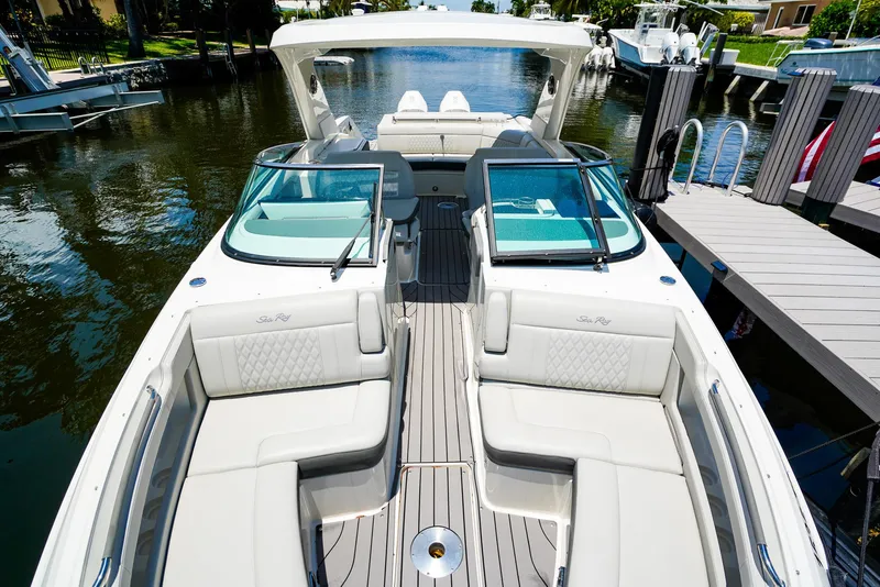 Slide: The Image of 2022 Sea Ray SLX 310 OB luxury boat with spacious seating and sleek design. - 25