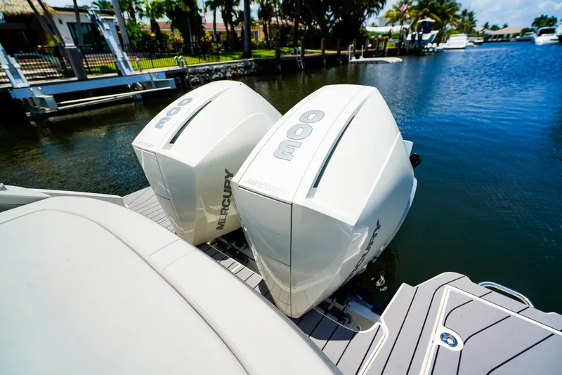 Slide: The Image of 2022 Sea Ray SLX 310 OB with twin Mercury outboard engines on a sunny day. - 6