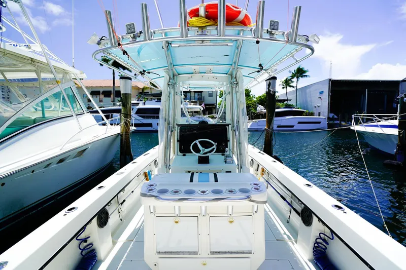 Slide: The Image of 2001 Whitewater 28 Open boat docked, featuring a spacious deck and modern amenities. - 10