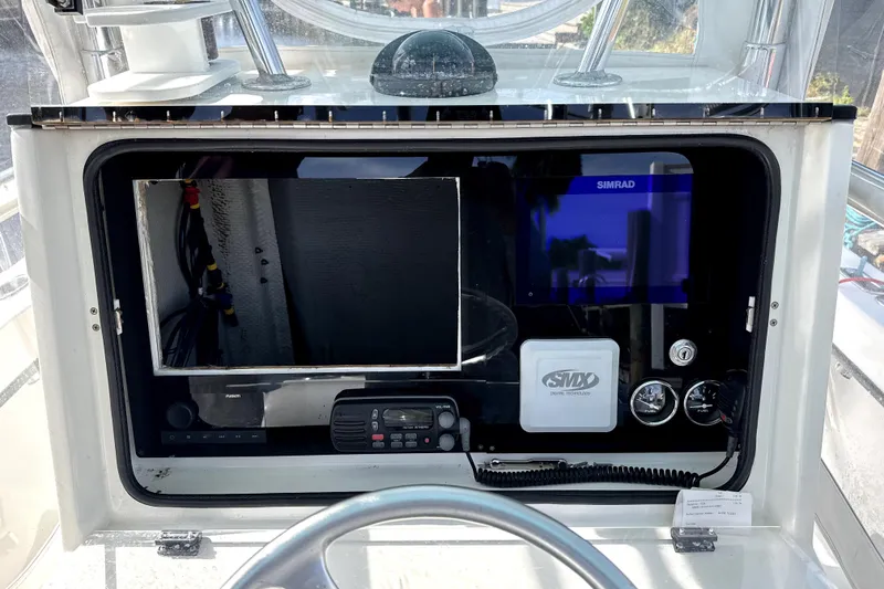 Slide: The Image of Boat dashboard with navigation equipment on a 2001 Whitewater 28 Open. - 11