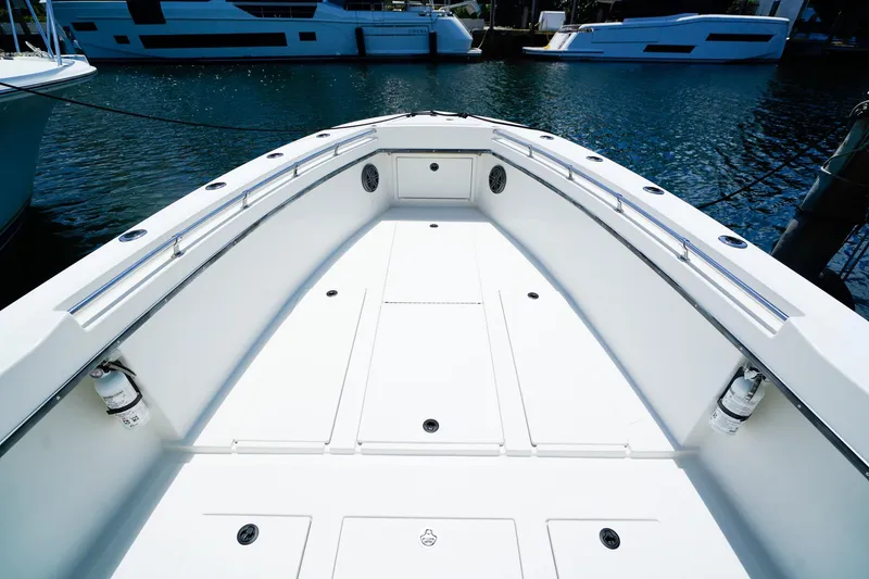 Slide: The Image of 2001 Whitewater 28 Open boat deck with sleek design and spacious layout. - 14
