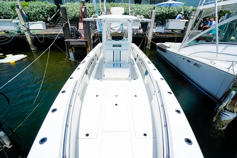 Slide: The Image of 2001 Whitewater 28 Open boat docked at marina, viewed from bow. - 17