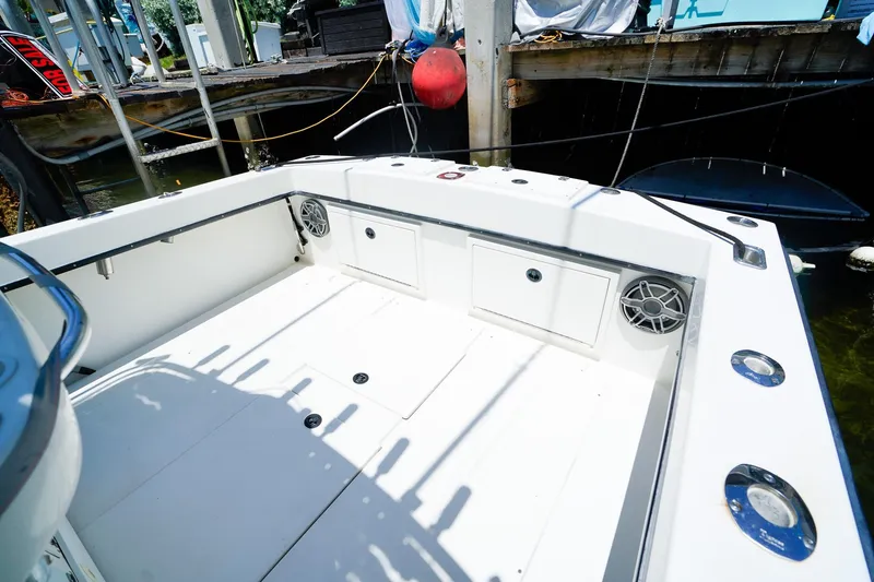 Slide: The Image of 2001 Whitewater 28 Open boat interior with storage compartments and speakers. - 5