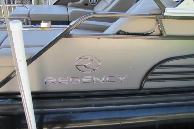 Slide: The Image of 2018 Regency 220 DL3 pontoon boat with sleek design and comfortable seating. - 15