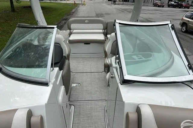 Slide: The Image of 2023 Crownline 260 SS boat interior with open windshield and seating area. - 5