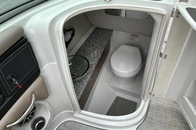 Slide: The Image of 2023 Crownline 260 SS boat interior with modern bathroom amenities. - 6