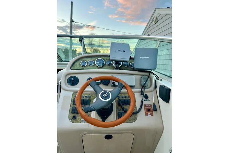 Slide: The Image of Helm of 2000 Sea Ray 270 Sundancer with Garmin and Raymarine navigation systems. - 11