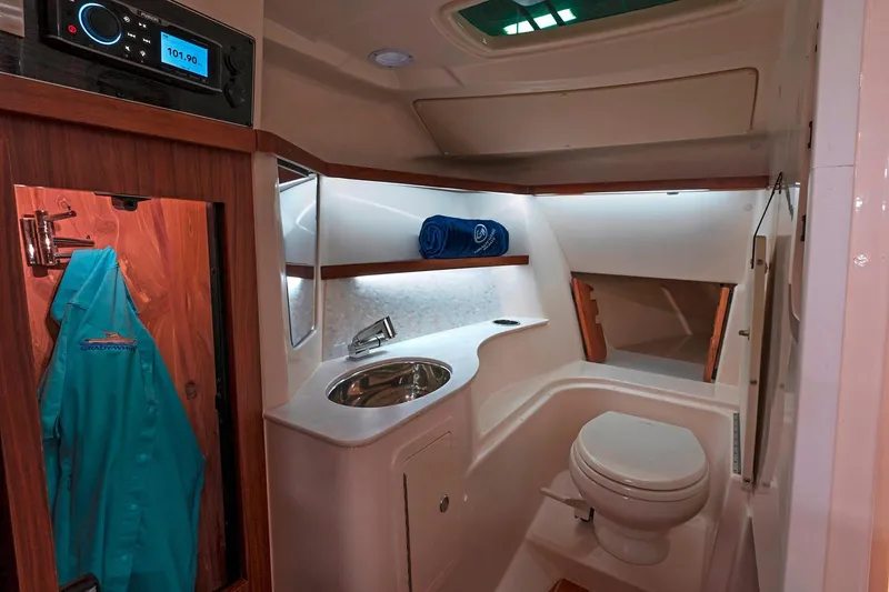 Slide: The Image of Manufacturer Provided Image: 2020 Grady-White Freedom 325 boat interior bathroom with sink and toilet. - 12