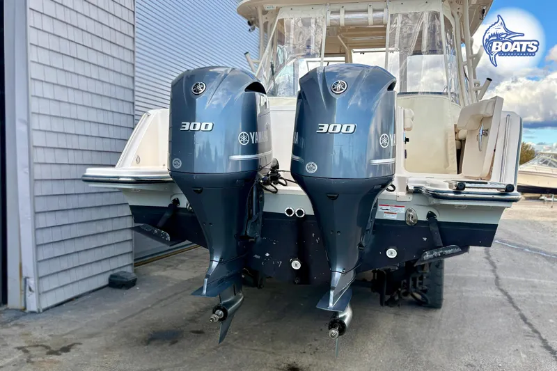 Slide: The Image of 2020 Grady-White Freedom 325 boat with dual Yamaha 300 engines, docked outdoors. - 20