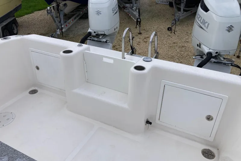 Slide: The Image of 2021 Twin Vee 280 GFX CC boat deck with Suzuki outboard engines. - 15