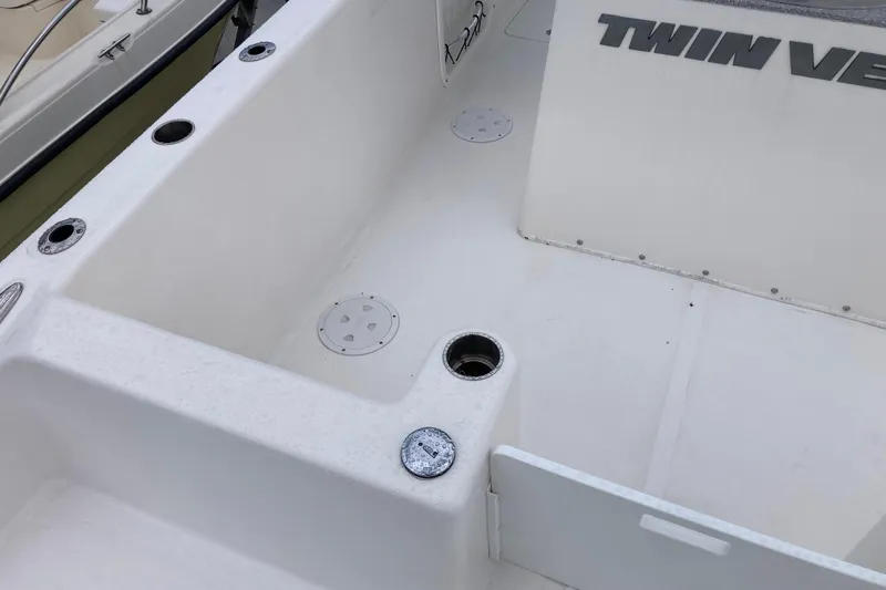 Slide: The Image of 2021 Twin Vee 280 GFX CC boat interior with rod holders and clean deck design. - 4