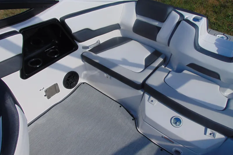 Slide: The Image of Interior seating of 2026 Yamaha Boats AR195, featuring cup holders and sleek design. - 13