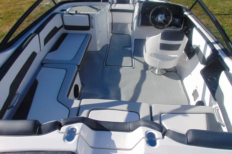 Slide: The Image of 2026 Yamaha Boats AR195 interior with sleek seating and modern helm design. - 6