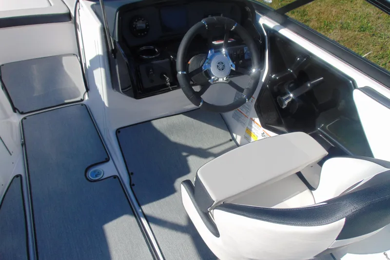 Slide: The Image of 2026 Yamaha Boats AR195 cockpit with steering wheel and seating. - 7