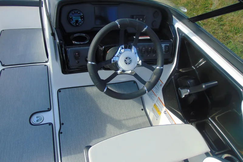 Slide: The Image of 2026 Yamaha Boats AR195 steering console with modern controls and sleek design. - 9