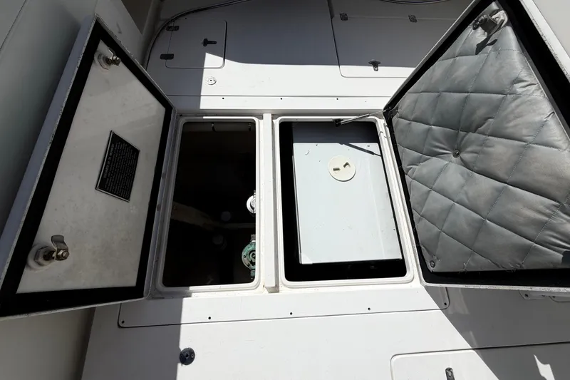 Slide: The Image of Open storage compartments on a 2008 Intrepid 350 Center Console boat deck. - 11