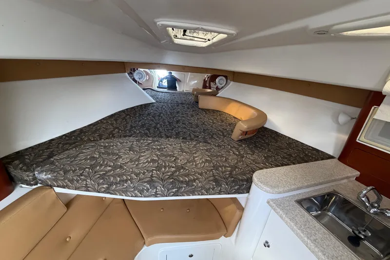 Slide: The Image of Interior of 2008 Intrepid 350 Center Console boat with seating and kitchenette. - 31