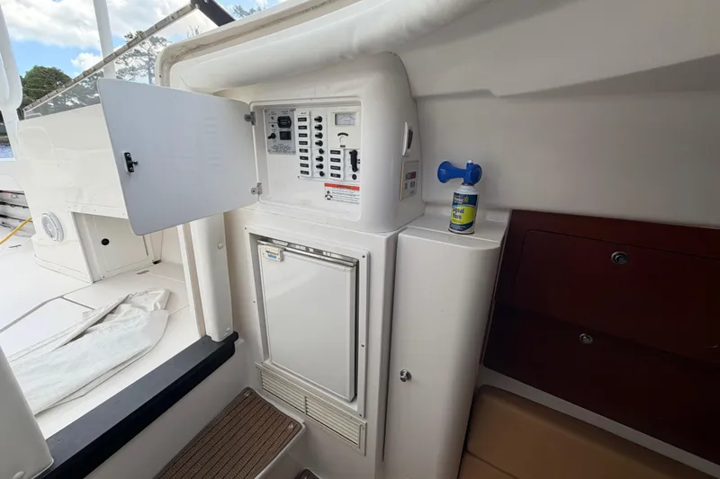 Slide: The Image of 2008 Intrepid 350 Center Console interior with control panel and storage compartments. - 38