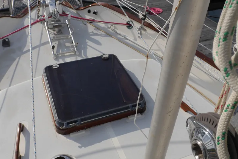 Slide: The Image of 1976 Westsail 32 sailboat with radar and solar panel at marina. - 14