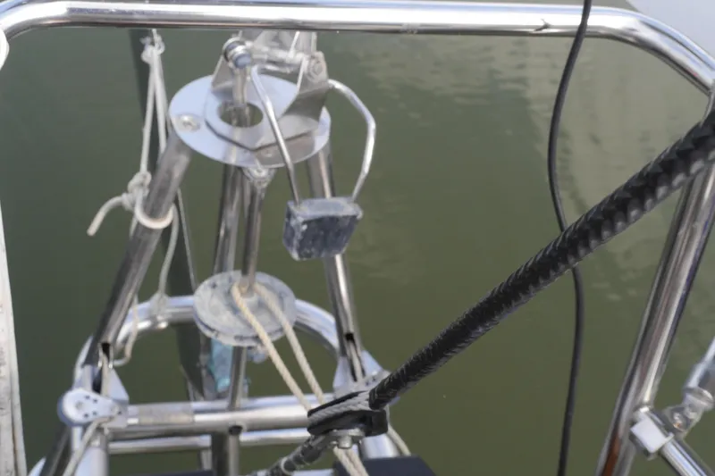 Slide: The Image of Stainless steel grill mounted on a 1976 Westsail 32 sailboat at a marina. - 21