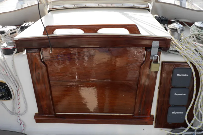 Slide: The Image of Control panel of a 1976 Westsail 32 sailboat with navigation instruments and ropes. - 27