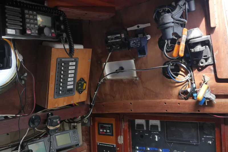 Slide: The Image of 1976 Westsail 32 sailboat detail with wooden and metal fittings at marina. - 31