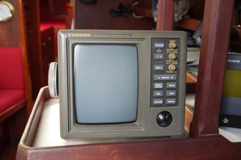 Slide: The Image of 1976 Westsail 32 boat interior with Furuno facsimile receiver and VHF radio equipment. - 38