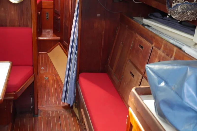 Slide: The Image of 1976 Westsail 32 interior with Dickinson Caribbean stove and wooden cabinetry. - 44
