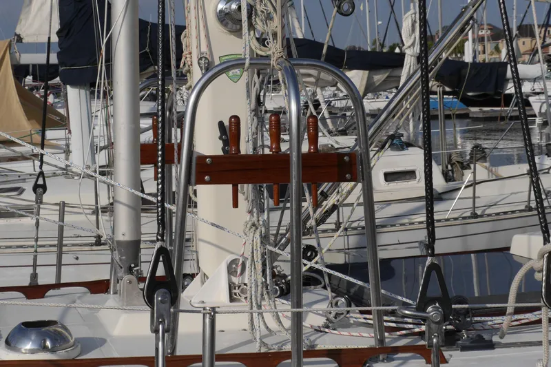 Slide: The Image of Bow of 1976 Westsail 32 sailboat with metal deck and ropes at dock. - 5