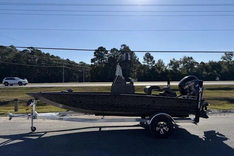 The Image of 2026 Xpress H190B Bay boat on trailer, parked roadside under clear sky. - 0