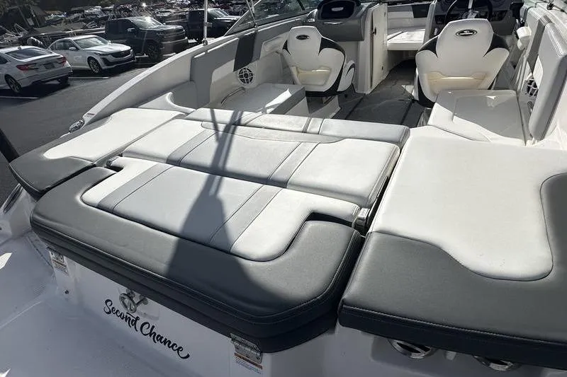 Slide: The Image of 2022 Chaparral 23 SSi boat interior with cushioned seating and "Second Chance" name. - 11