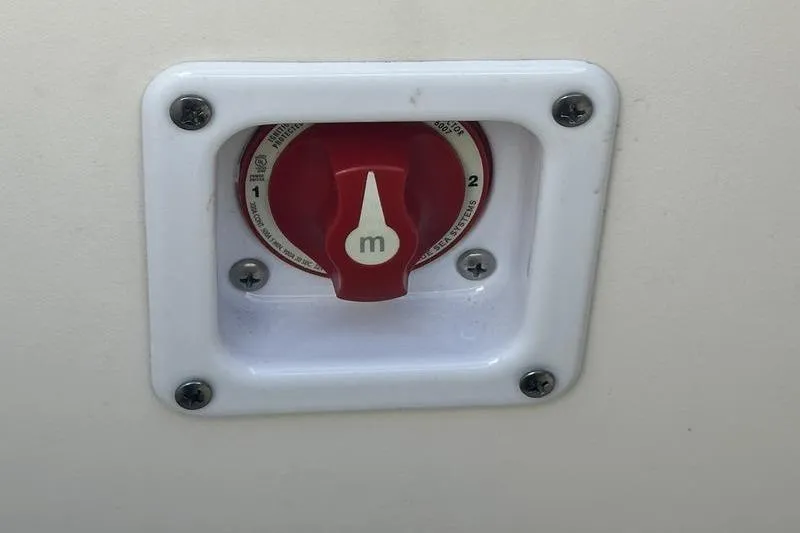 Slide: The Image of Red battery switch on 2022 Chaparral 23 SSi boat. - 15