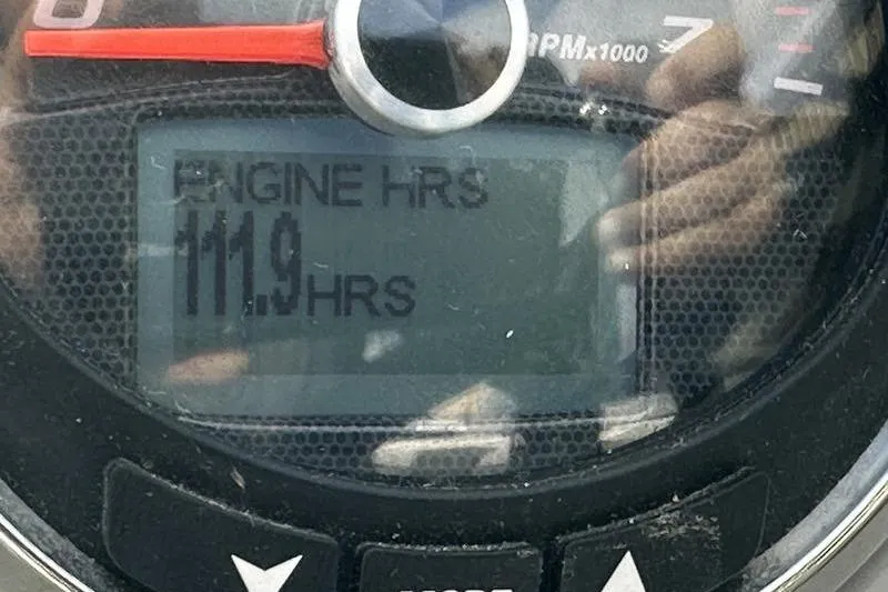 Slide: The Image of Close-up of Chaparral 23 SSi 2022 engine hour meter displaying 111.9 hours. - 19