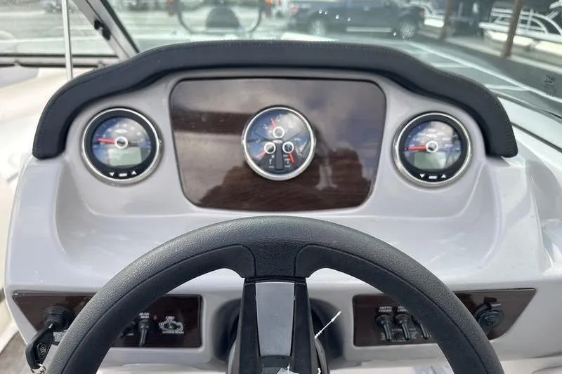 Slide: The Image of Dashboard of 2022 Chaparral 23 SSi boat with steering wheel and gauges. - 21
